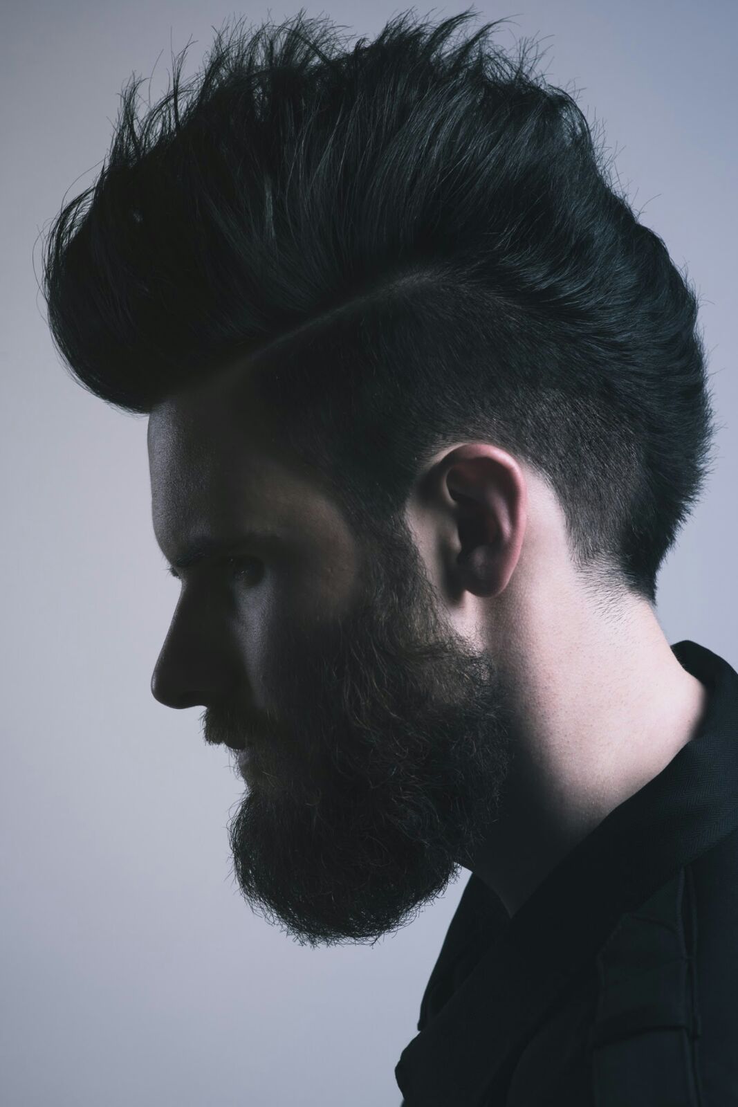 Dark textured quiff with a taper and beard